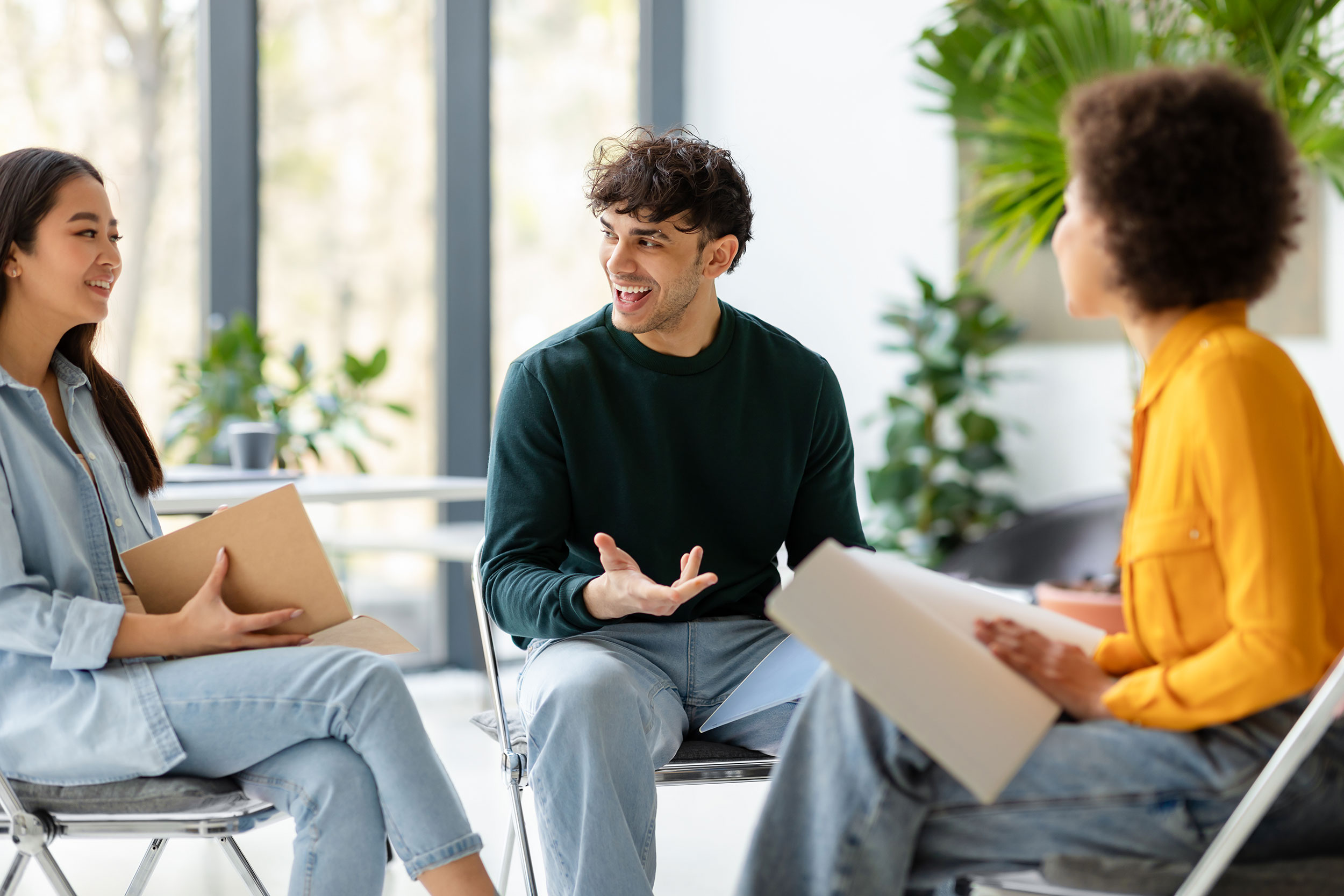 Behavioral health professionals reviewing program development materials